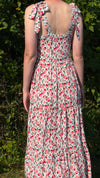 Young caucasian woman wearing pink & red floral Maven Maxi Sundress (back view)