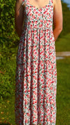 Young caucasian woman wearing pink & red floral Maven Maxi Sundress (front view)