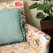Teal and white spots ruffled cushion