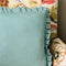 Teal and white spots ruffled cushion