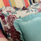 Teal and white spots ruffled cushion and red and turquoise floral ruffled cushion