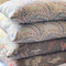 Stack of elegant grey floral linen cushion covers