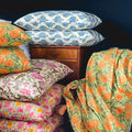 Indian hand-blocked cushions and orange and green fabric